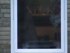 Woman spied nude through kitchen window