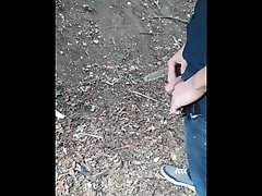 My man pissing in the woods