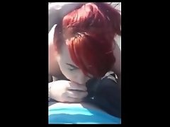 Redhead sucking cock at the lake and swallows the load