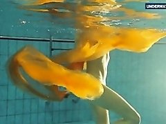 Yellow and Red clothed teen underwater