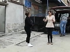 A girl with huge breasts dancing in the street 2